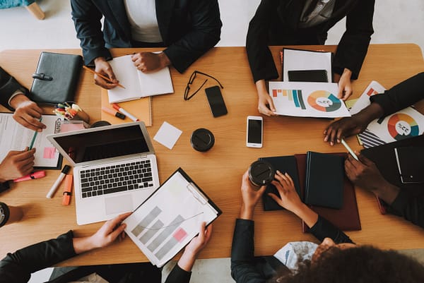 Top View of Business People on Meeting in Office. Top View of Business People on Meeting in Office.